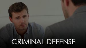 criminal defense lawyer consulting with client