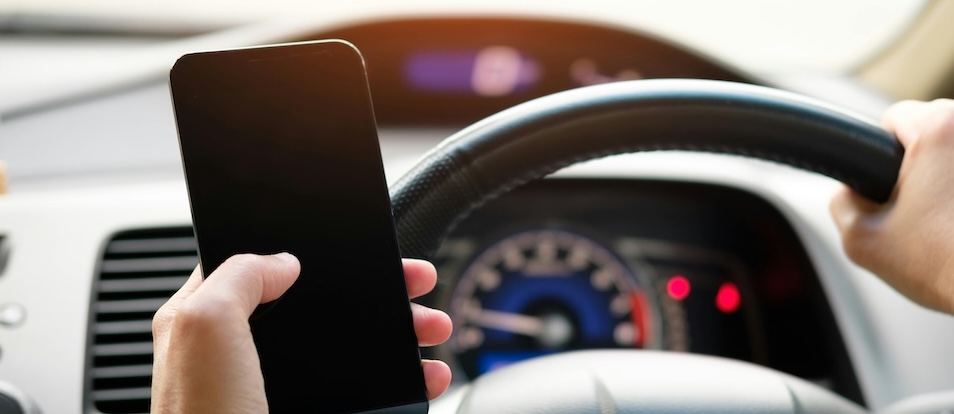 Can I be charged with texting while driving on private property?