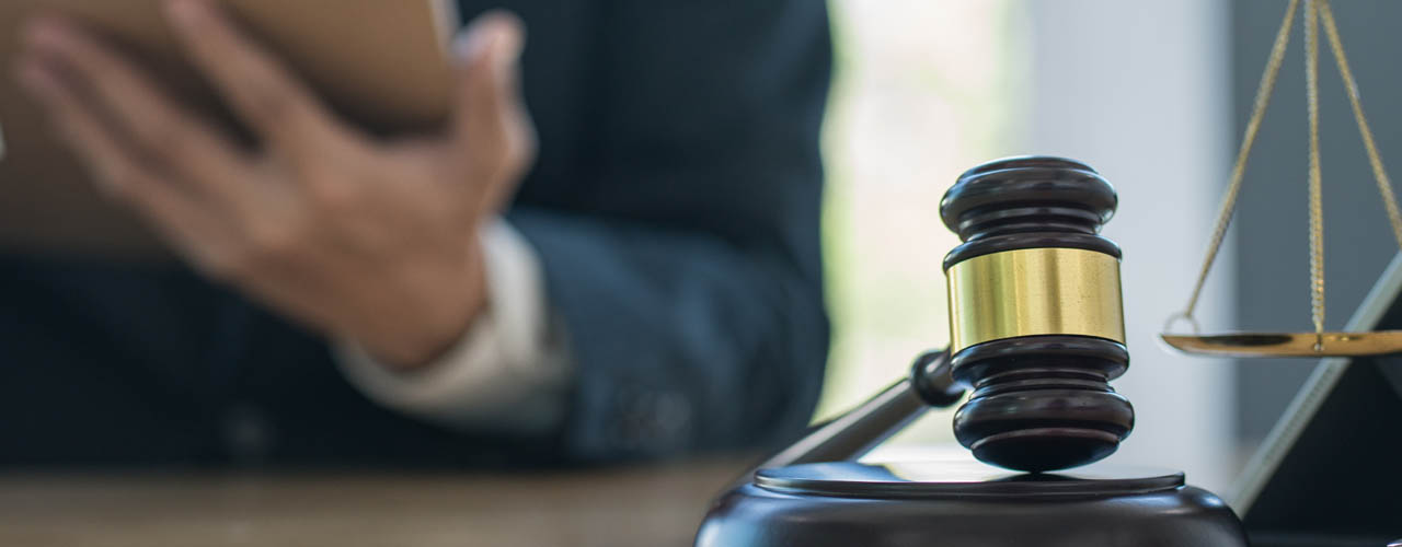 Justice and law concept.Male judge in a courtroom with the gavel